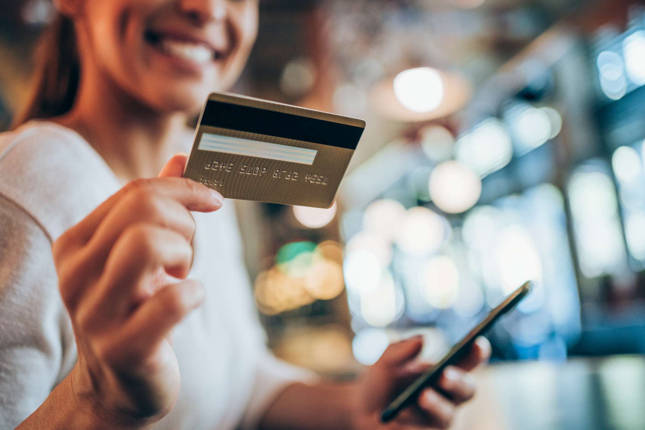  Woman holding credit card